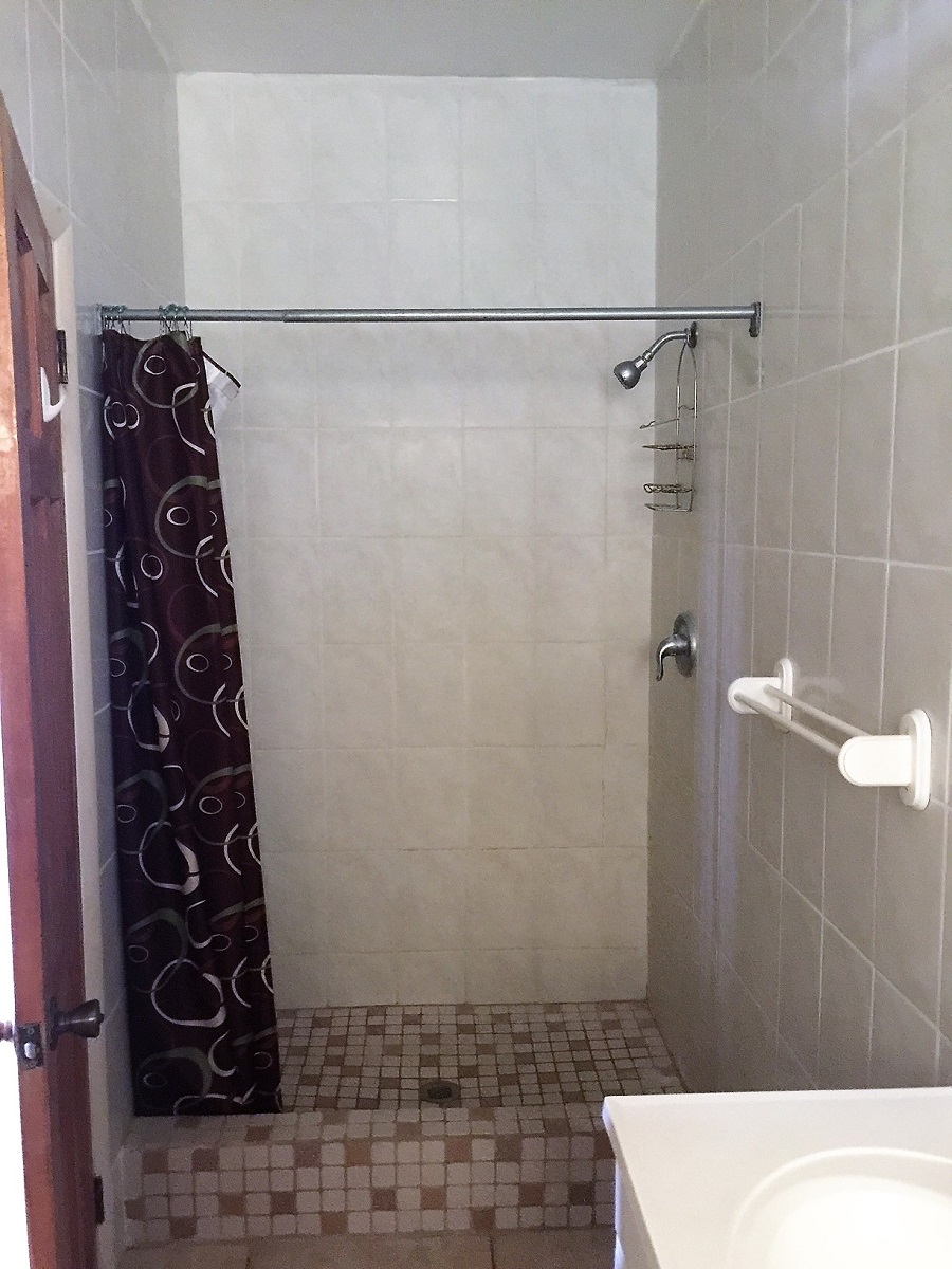 Bathroom shower at the Oasis in the Tropics Villa One Bed One Bath Apartment Student Rentals