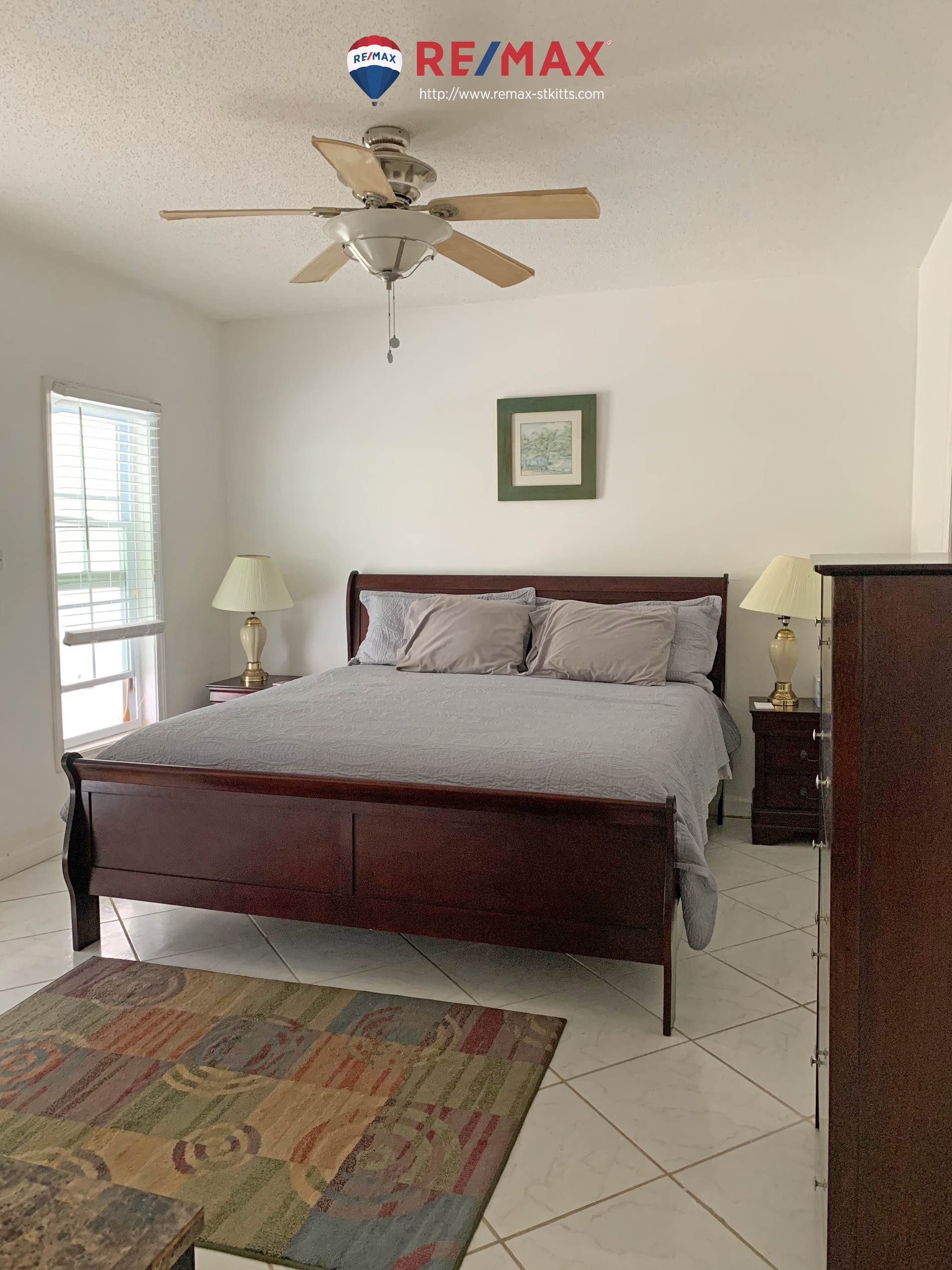 Bedroom of smaller side of 2 bedroom citizenship approved condo for sale st. kitts
