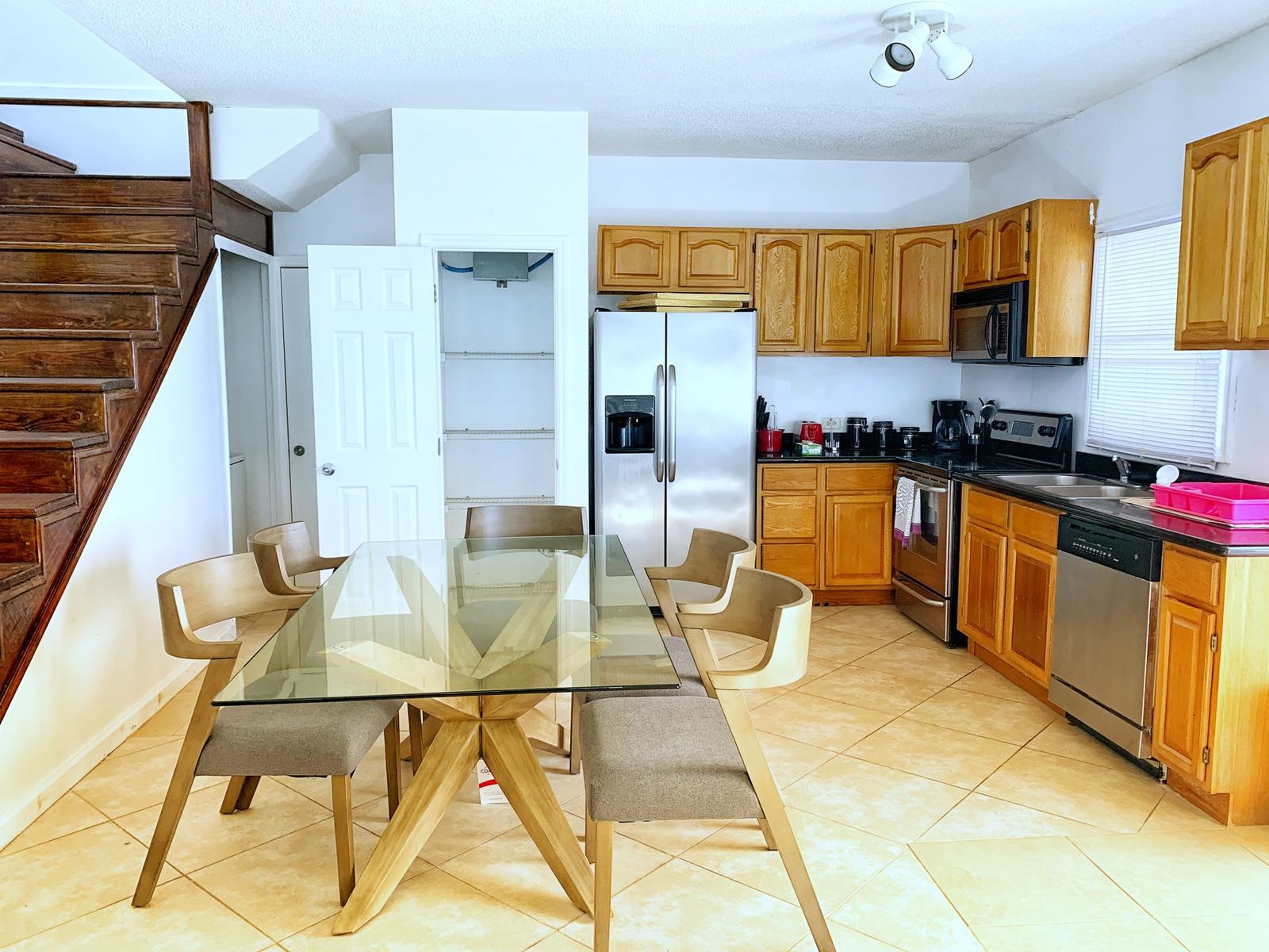Kitchen and Dining area in the St. Christopher Club Newly Furnished 3 Bed 3 Bath Penthouse! 