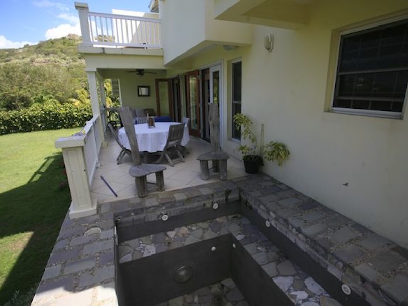 Lower level patio with plunge pool the backyard of the Calypso Dreams villa for sale St. Kitts! 