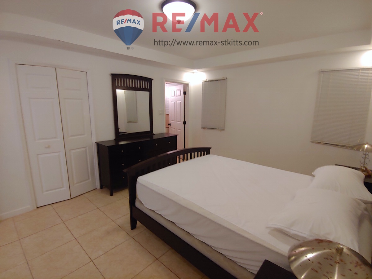 Third angle of guest bedroom of Manor by the Sea 3 bedroom 3 bathroom condo for sale St. Kitts