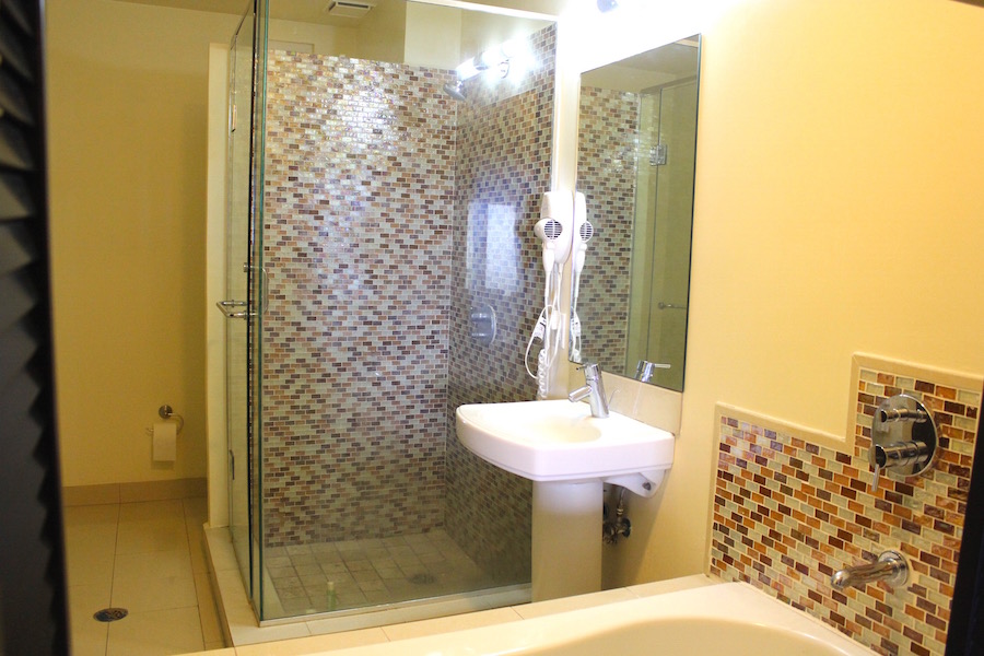   Full bathroom with separate tub and shower in the Ocean's Edge One Bedroom Studio For Sale St. Kitts